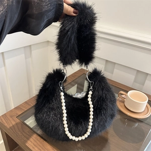 Chic black faux fur underarm bag with elegant white pearl chain for winter style