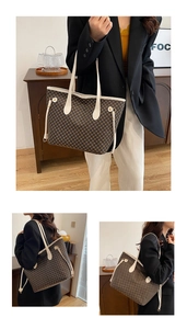 Detail view of large tote bag with brown dot pattern and white side drawstring accents