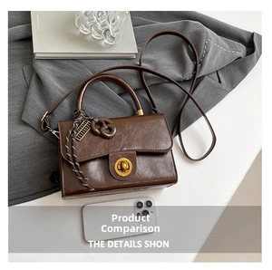 Detailed view of dark brown vintage flap bag with size reference to a mobile phone