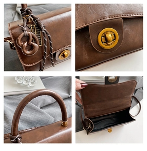 Detail of brown vintage crossbody bag with gold hardware, knot charm and woven texture