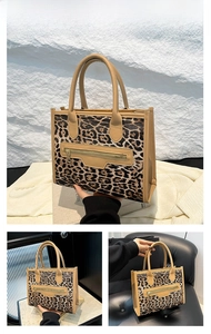 Detail view of khaki leopard print tote bag with horizontal zipper and round handles