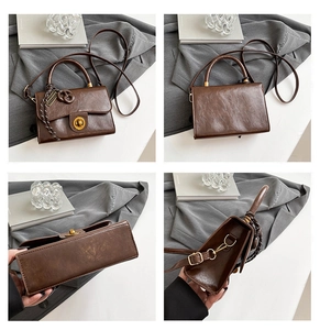 Detail view of a vintage dark brown handbag showing front, back, bottom and side profiles