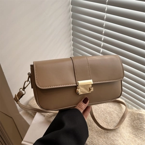 Minimalist square crossbody bag in matte khaki leather with elegant gold metal buckle