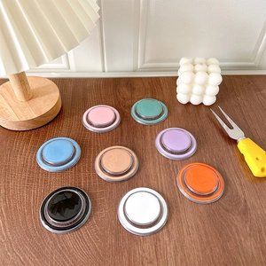 Minimalist magnetic solid color phone sockets in eight pastel colors on wooden desk