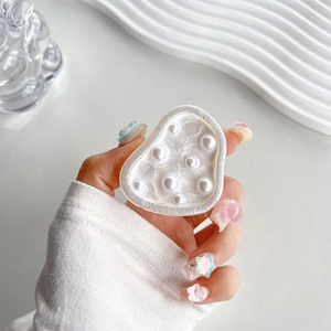 Detail of pearlescent heart phone socket with elegant pearl beads and glitter finish