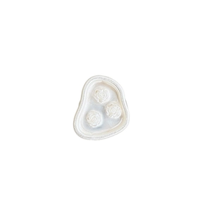 Floral pearl-like retractable phone grip featuring embossed roses on a creamy white base