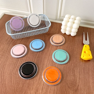 Set of eight colorful magnetic telescopic phone socket stands on a wooden desk setup