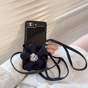 Detail of crossbody phone case for Samsung Z Flip 6 with large black rhinestone flower