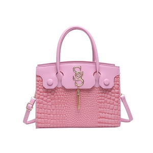Pink croc-embossed small square handbag with golden SS logo and fringe detailing