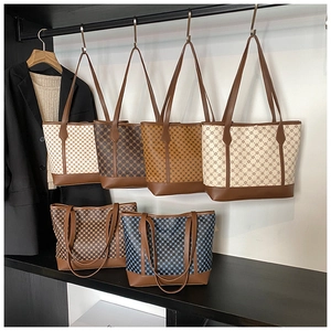 Detailed display of vintage patterned tote bags in various plaid and geometric colors