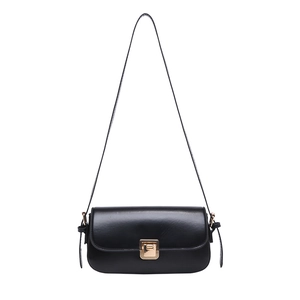Minimalist black flap crossbody bag with a vintage square gold rotating lock closure