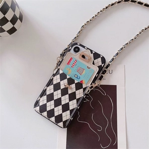 Detail of checkered leather iPhone case with card holder slot and crossbody chain strap