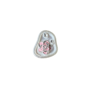 Pink enamel rose phone grip with silver edges and teardrop gems on a white background
