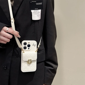 White quilted leather crossbody case for iPhone with bow detail and gold clasp wallet