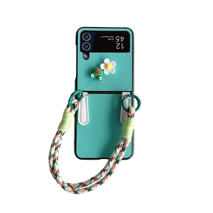 Minzgrüne klappbare Handyhülle mit Frosch, Blume und geflochtener Handschlaufe für Z Flip