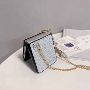 Detailed view of sparkly rhinestone case for Samsung Z Flip with gold chain strap