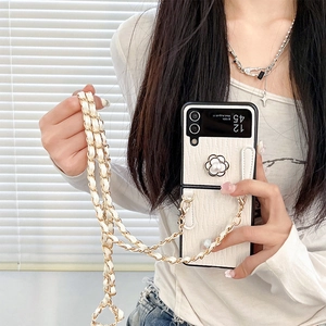 White leather folding phone case with camellia pearl decor and golden chain strap