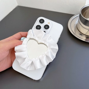 White heart-shaped satin fabric phone grip with makeup mirror and pleated lace edge