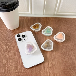 Telescopic resin phone grip with glitter frame and colorful faux gemstone heart patterns