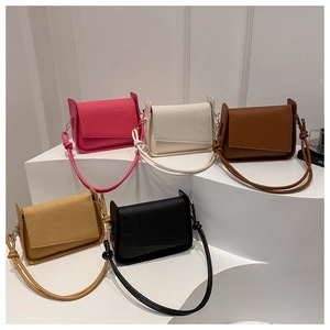 Collection of textured leather crossbody bags in pink, beige, brown, yellow and black colors