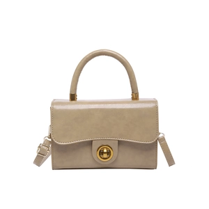 Schicke beige Umhängetasche mit goldenem Drehverschluss und rundem Griff im Vintage-Stil