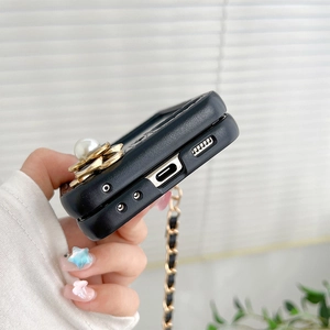 Detail of crossbody phone case with camellia pearl holder and precise cutouts