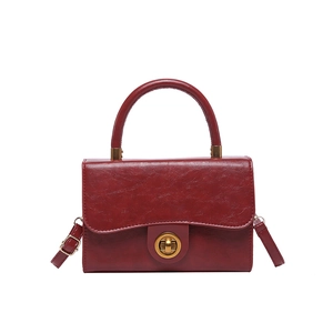 Vintage wine red flap crossbody bag with golden twist lock and pleated leather texture