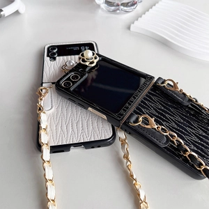 Detail of camellia pearl leather phone case with crossbody chain for flip phones