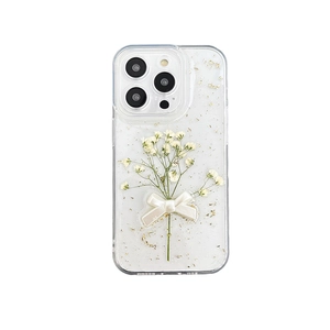 Floral iPhone case with dried flowers, gold foil, and a white 3D bow decoration