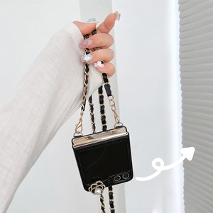 Detail of Z Flip case with camellia flower, pearl charm, and leather chain strap