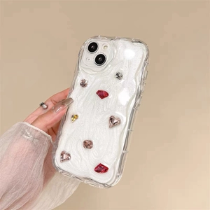 Detailed view of the sparkling rhinestone gems on the pearly glitter iPhone case
