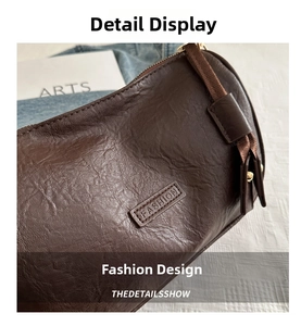 Detailed close-up of dark brown vintage cylinder bag with textured leather and fashion label