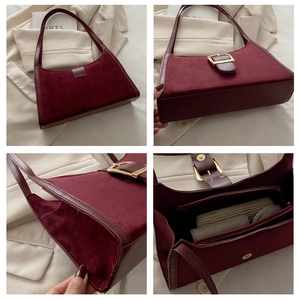 Detailed interior compartments and suede texture of the burgundy crescent shoulder bag