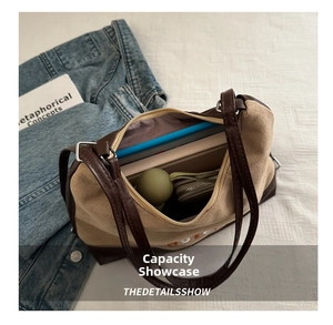 Interior view showing large capacity for umbrella and notebook in suede tote bag