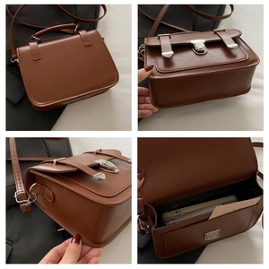 Dettaglio borsa a tracolla vintage marrone in pelle PU con interno e fibbie argentate