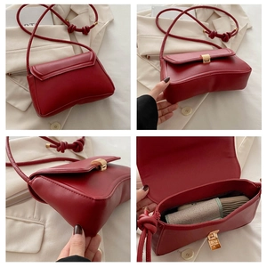 Detailed views of burgundy underarm bag featuring gold hardware and knotted strap design