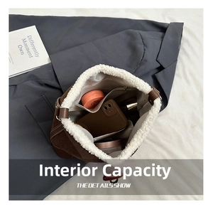 Detail of corduroy shoulder bag showing large capacity and soft plush lining texture