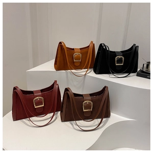 Four vintage faux suede underarm bags in multiple colors with gold buckle hardware