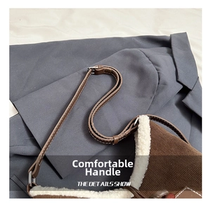 Detail of corduroy and faux shearling patchwork tote bag with brown leather strap