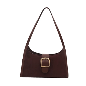Retro dark brown suede underarm bag with square gold buckle and leather strap on white background