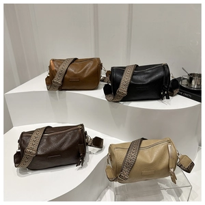 Classic Boston mini cylinder bags in faux leather with colorful woven crossbody straps