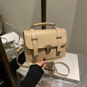 Minimalist beige matte leather crossbody messenger bag with vintage metal buckle