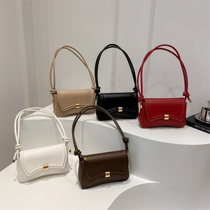 Minimalist vintage baguette bags in five colors with knot handle on tiered display