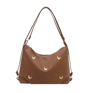 Brown faux leather tote bag with elegant golden butterfly charms and top zipper closure