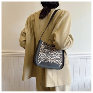Detail of leopard print hobo shoulder bag styled with a beige blazer for women