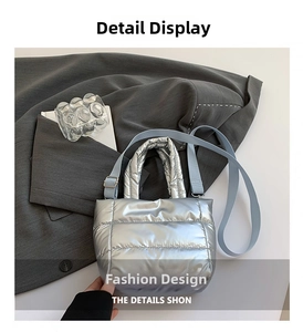 Close-up of silver metallic quilted handbag with adjustable strap and refined stitching