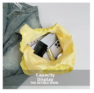 Detailed top view of a lemon yellow cloud tote bag showing spacious interior capacity