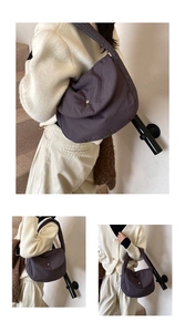 Deep grey-purple quilted shoulder bag with snap closure and lightweight padded fabric