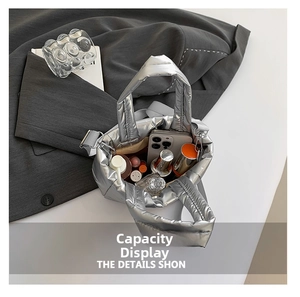 Detail view of silver quilted tote bag showing spacious interior with everyday essentials