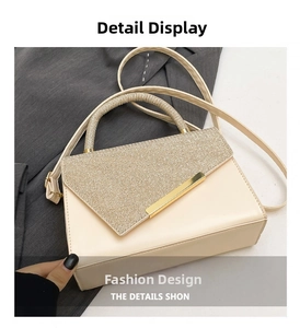 Detail of off-white crossbody bag featuring golden glitter flap and metallic bar